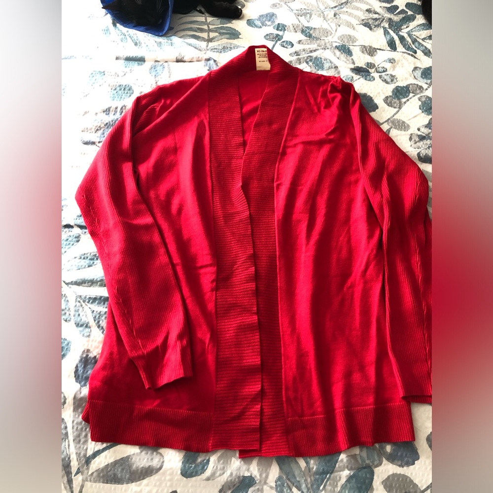 Bright red ladies knit sweater. No button cardigan